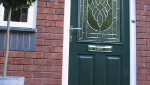Green composite door with gold hardware