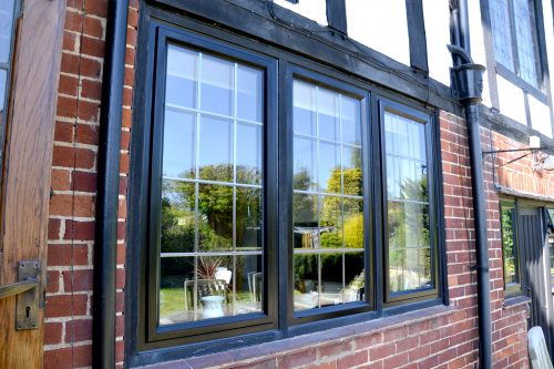 Steel replacement windows in black aluminium