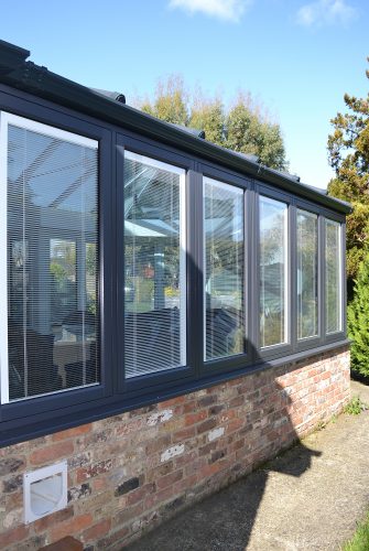 Row of Flush Windows On Anthracite Grey Conservatory