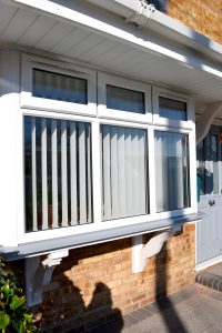 uPVC Casement Window in white sat on elephant grey cill