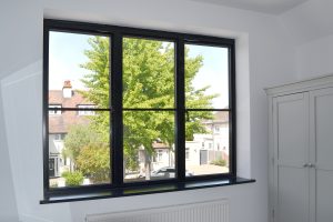 Black aluminium window with astragal bar