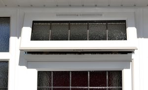 White casement window with leaded glass